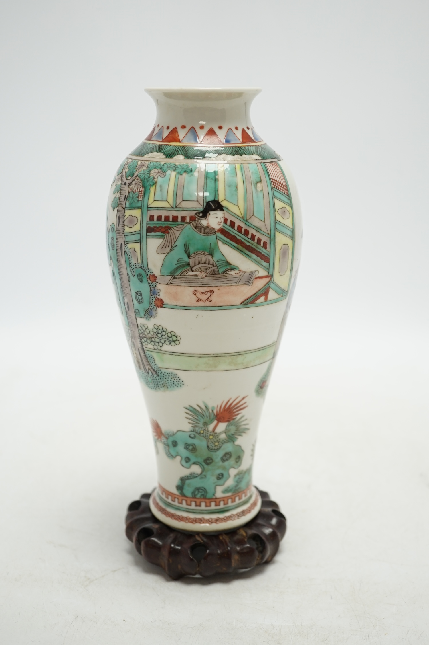 A 19th century Chinese porcelain famille verte vase and associated hardwood stand, 23cm high. Condition - good